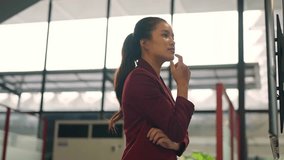 Pensive asian businesswoman using an interactive touchscreen monitor in a modern office building - Powered by Shutterstock - Get 15% off with code: PIKWIZARD15