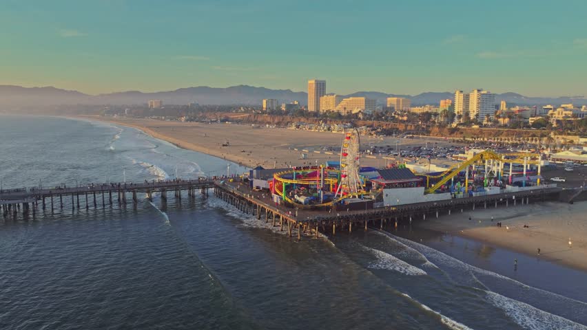 Aerial stunning sunset at Santa Monica Pier with Los Angeles skyline 