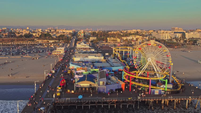 Aerial stunning sunset at Santa Monica Pier with Los Angeles skyline 