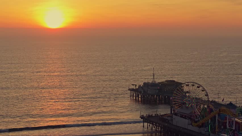 Aerial stunning sunset at Santa Monica Pier with Los Angeles skyline 