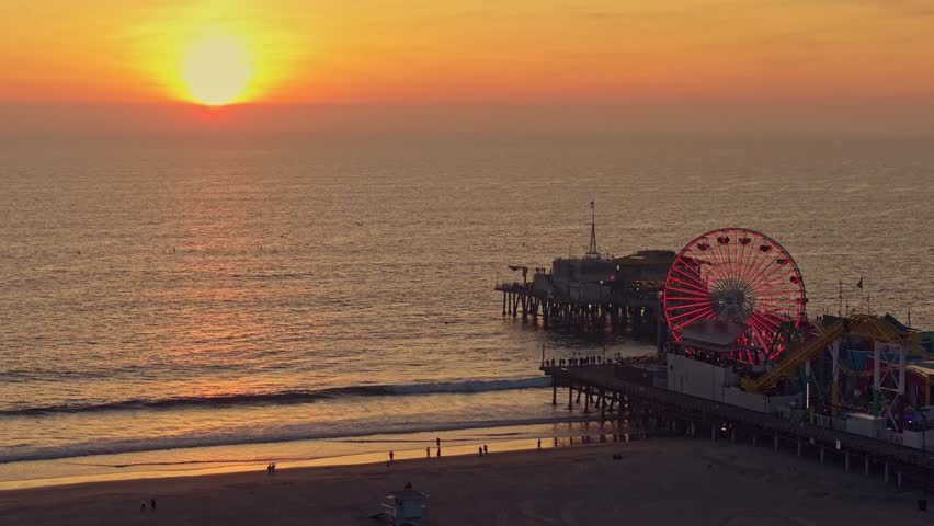 Aerial stunning sunset at Santa Monica Pier with Los Angeles skyline 