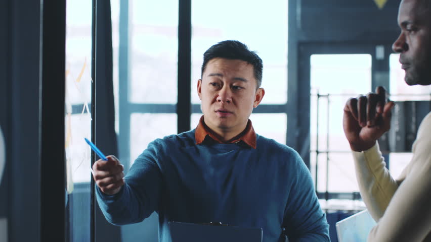 Business Meeting With Discussion on Strategy in a Modern Office Setting