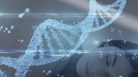 Binary coding and dna structure spinning against male surgeon wearing vr headset. Global science data processing and digital interface concept digitally generated video. - Powered by Shutterstock - Get 15% off with code: PIKWIZARD15