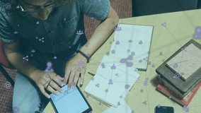 Adult male tapping tablet with stylus and expanding social media network overlay over notebooks. Technology, connectivity, innovation, collaboration, digital, workspace, modern - Powered by Shutterstock - Get 15% off with code: PIKWIZARD15