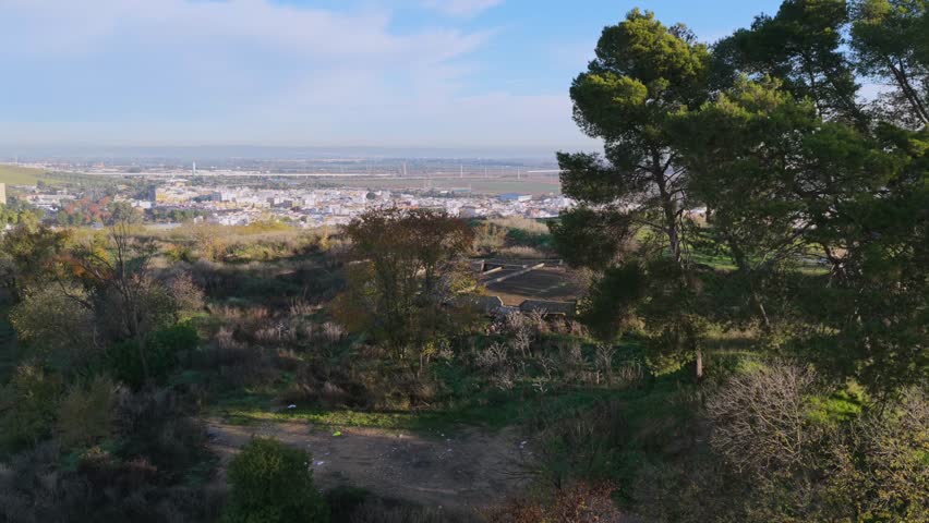 The historic Carambolo treasure archeological exploring place and distant residential community area of Camas, Sevilla, Spain