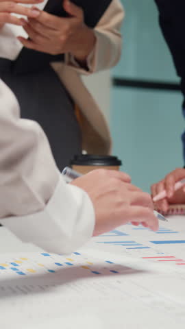Vertical Screen : Closeup happy young Asia businesspeople meeting brainstorming some new ideas about project to partner working together planning success strategy enjoy teamwork in modern home office.