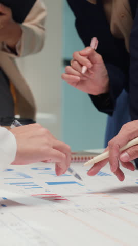 Vertical Screen : Closeup happy young Asia businesspeople meeting brainstorming some new ideas about project to partner working together planning success strategy enjoy teamwork in modern home office.
