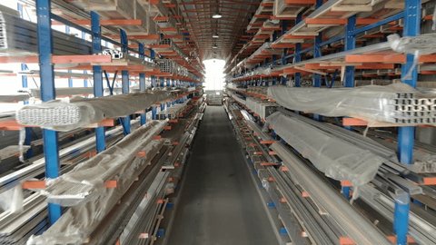Drone Flying Forward Inside Aluminum Warehouse