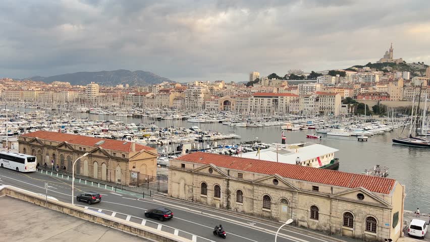 Relaxed autumn afternoon in Marseille on the Mediterranean coast of France. Scenic old harbor, calm atmosphere, and authentic daily life by the sea.