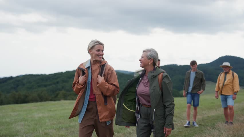 Multigenerational family on hiking trip in nature.