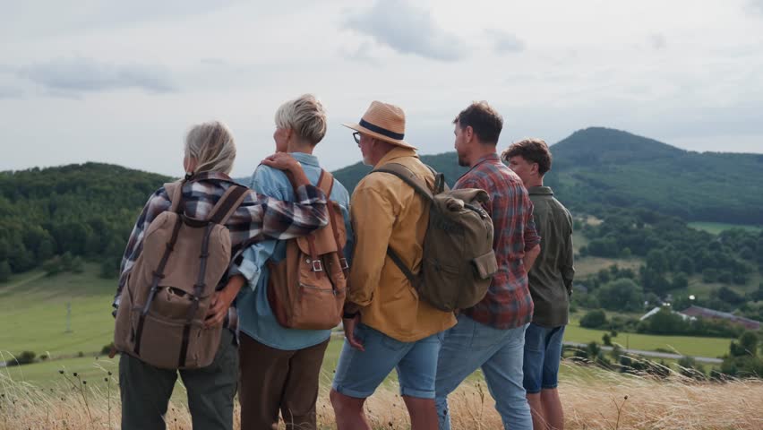 Multigenerational family on hiking trip in nature.