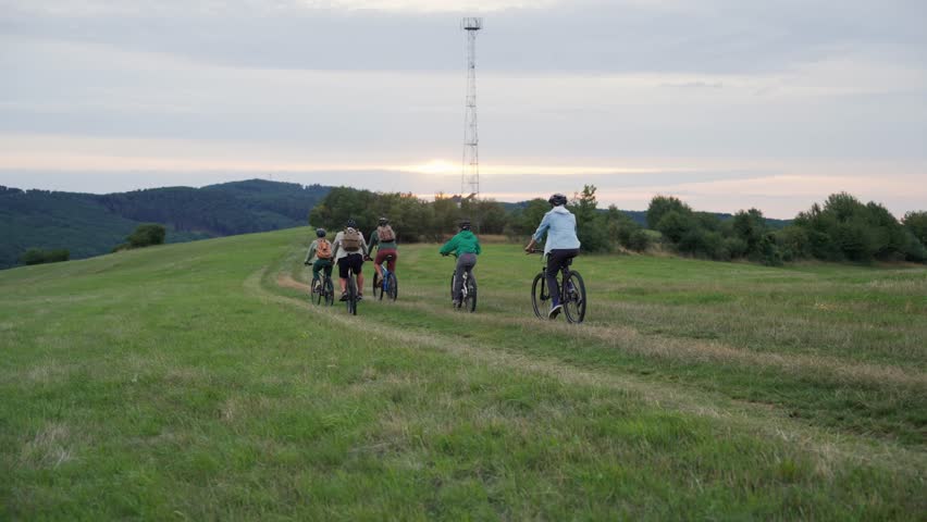 Family biking adventure in nature. Cycling trip during autumn day.