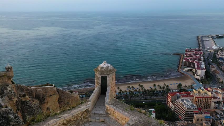 Aerial view of the Marinas inside the port of Alicante, the beach of El Postiguet and Santa Barbara Fortress in the Mediterranean city of Alicante, Spain.