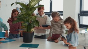 Schoolkids using tablets during biology, science class.. - Powered by Shutterstock - Get 15% off with code: PIKWIZARD15