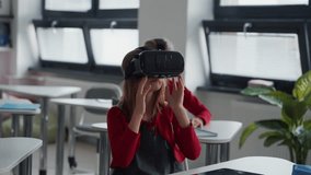Elementary school students using virual reality in classroom. - Powered by Shutterstock - Get 15% off with code: PIKWIZARD15