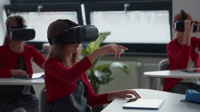 Elementary school students using virual reality in classroom. - Powered by Shutterstock - Get 15% off with code: PIKWIZARD15