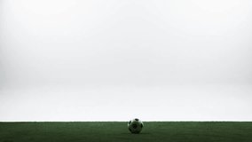 Dynamic soccer player sprinting to kick the ball in studio. Concept of driven shot, football training, power movement, athletic energy, focus, motion control and sport advertising visuals. - Powered by Shutterstock - Get 15% off with code: PIKWIZARD15