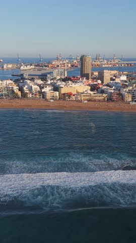 Panoramic aerial view of the city of Las Palmas de Gran Canaria, its port, and the popular beach, Las Canteras. 
