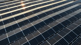 aerial footage of an industrial warehouse with solar panels on it - Powered by Shutterstock - Get 15% off with code: PIKWIZARD15