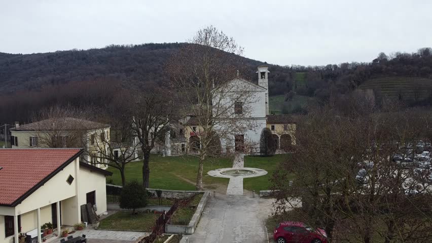 Aerial view of the historic Santa Maria Assunta Church, known as La Rotonda, in Rezzato, Italy. Ancient Romanesque architecture in the Valverde valley, Brescia province.