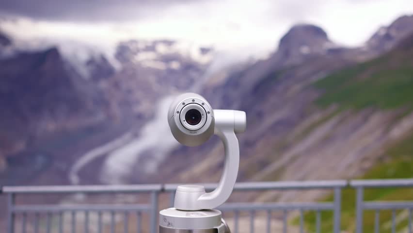  binocular telescope overlooking Pasterze Glacier and Grossglockner. famous scenic drive in Austria. popular summer travel tourism destination for hiking in Europe.