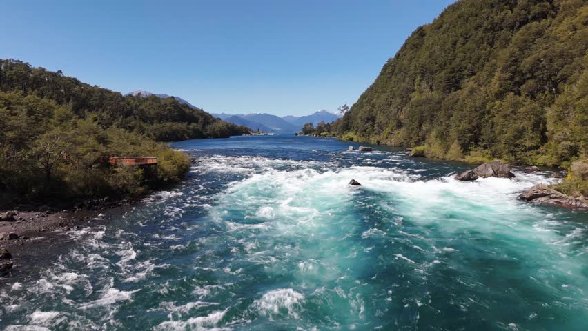 Drone Flying Low Over Churning Emerald Rapids of Petrohue River Chile