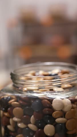 sipping coffee from a glass jar with a spoon