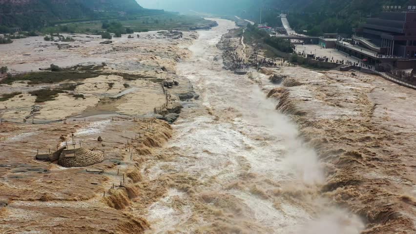 This dynamic video captures the awe-inspiring power of the Yellow River’s Hukou Waterfall, showcasing the mighty river surging forward with thunderous rapids and cascading torrents. The footage features close-up shots of churning waves, wide views of the roaring waterfall, and sweeping angles that highlight the river’s unstoppable momentum. Ideal for travel promotions, nature documentaries, cultural content, and scenic compilations, it vividly presents the grandeur of this iconic Chinese natural wonder.