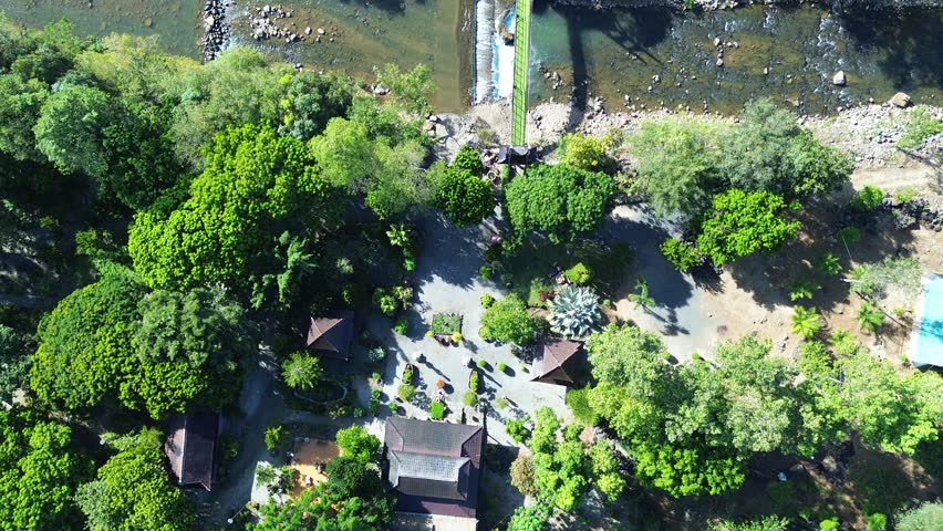 Beautiful landscape of a Buddhist temple located in Bao Loc city, Lam Dong province, Vietnam. Peaceful atmosphere, green nature, suitable for travel, meditation, religion, and cultural background use.