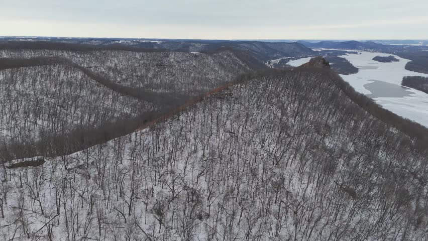 Winter forest on the bluffs next to the Minnesota valley of the Mississippi River Aerial view