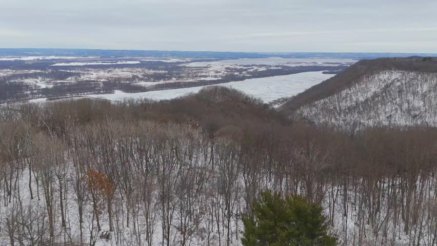 Winter forest on the bluffs next to the Minnesota valley of the Mississippi River In the Driftless Region