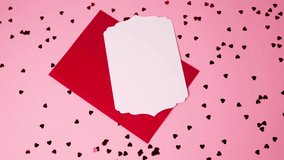 Elegant pink background with scattered hearts, red envelope and blank card for Valentine's Day - Powered by Shutterstock - Get 15% off with code: PIKWIZARD15