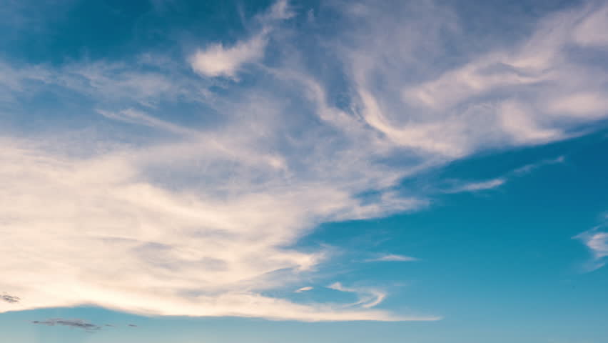 Evening sky time-lapse capturing the shift from sunset glow to nighttime darkness with subtle cloud movement.