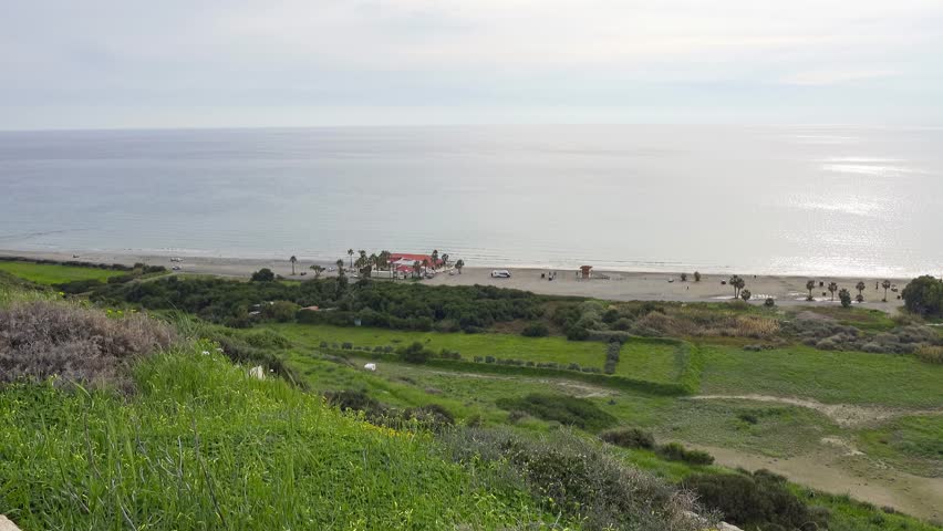Panning shot of Kourion Beach in Cyprus at sunset