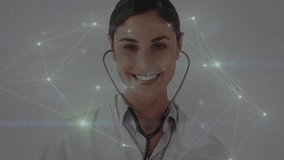 Animation of network of connections over caucasian female doctor smiling. Global medicine and digital interface concept digitally generated video. - Powered by Shutterstock - Get 15% off with code: PIKWIZARD15