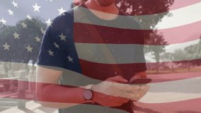 Animation of flag of usa over man using smartphone. American patriotism and diversity concept digitally generated video. - Powered by Shutterstock - Get 15% off with code: PIKWIZARD15