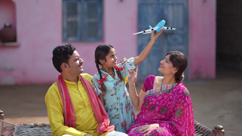 farmer daughter playing plane toy 