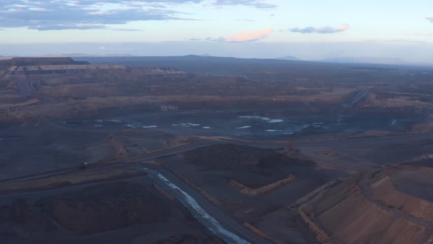 Aerial view of the Tete coal mine revealing the vastness of the excavation site with roads cutting through the landscape, Tete, Tete Province, Mozambique.