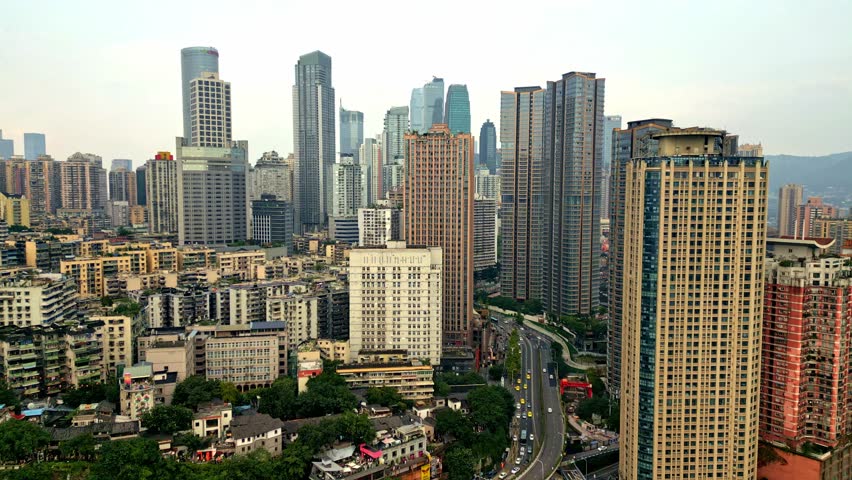 Aerial view of the city with tall buildings and roads, contrasting textures and tones create an immersive urban landscape, Chongqing, Chongqing, China.