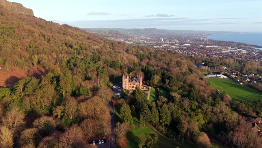 Reversing 60FPS 4K aerial video of Belfast Castle and Cave Hill in North Belfast, Northern Ireland on a bright autumn day. Produced with Rec709 color.