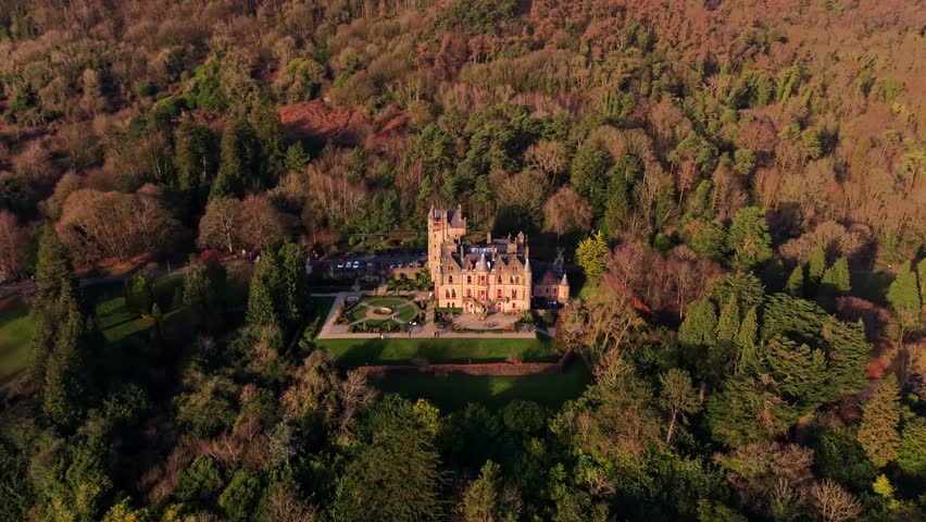 Clockwise 4K 60FPS aerial video of Belfast Castle and Cave Hill in North Belfast, Northern Ireland on a crisp autumn day. Produced with Rec709 color.
