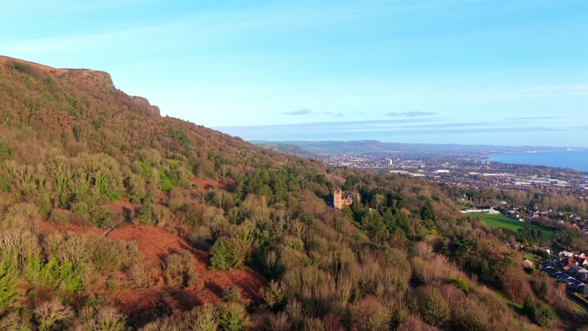 Ultra-wide advancing 4K 60FPS aerial video of Belfast Castle and Cave Hill in North Belfast, Northern Ireland on an autumn day. Produced with Rec709 color.