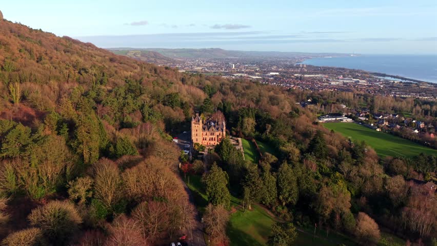 Rotating 4K 60FPS aerial video of Belfast Castle and Cave Hill in North Belfast, Northern Ireland on an autumn day. Produced with Rec709 color.