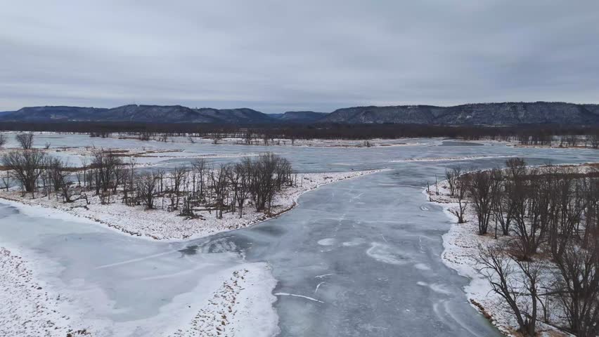 Frozen lazy river and many island on a winter wonderland scenic landscape scene in Driftless Region in Wisconsin Minnesota