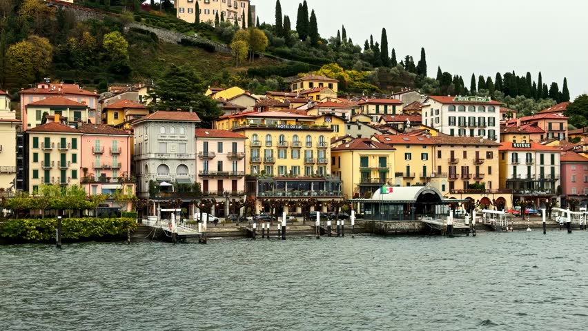 Colorful waterfront buildings in Bellagio overlooking Lake Como, showcasing classic Italian architecture and a scenic lakeside promenade in an travel setting.