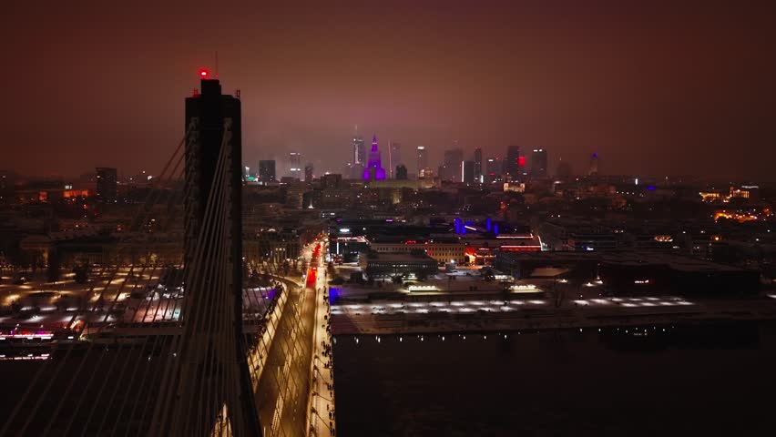 Cityscape of Warsaw, capital of Poland, fireworks explode throughout the city. New Year