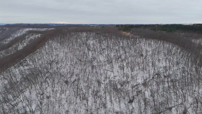 An aerial view of the Driftless Area shows snow-dusted bluffs near Winona, Minnesota during winter
