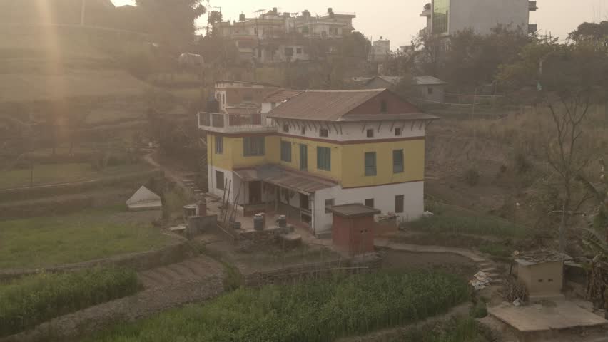 Aerial Drone View of Godawari City with Jungle and Mountains Divided by a Scenic Road, Nepal