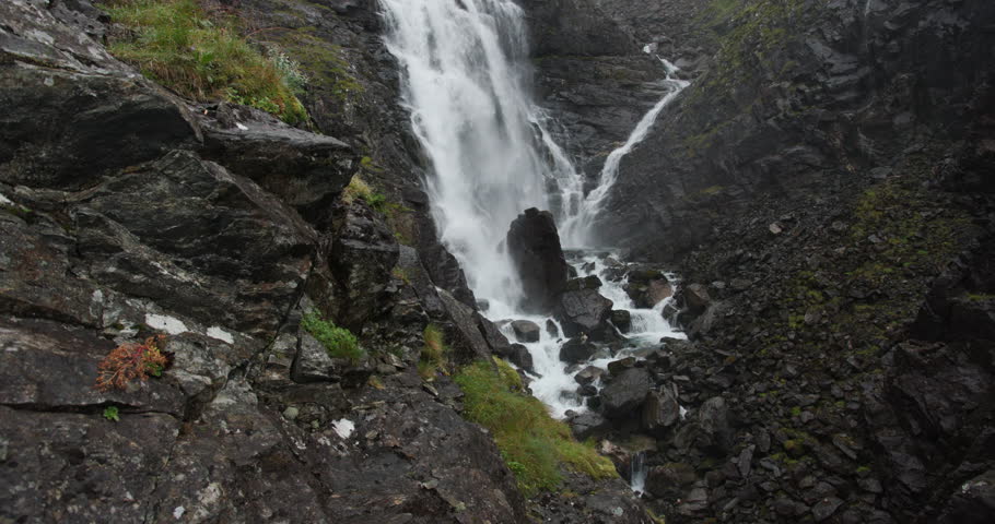 Powerful mountain waterfall cascading over rocks in norway