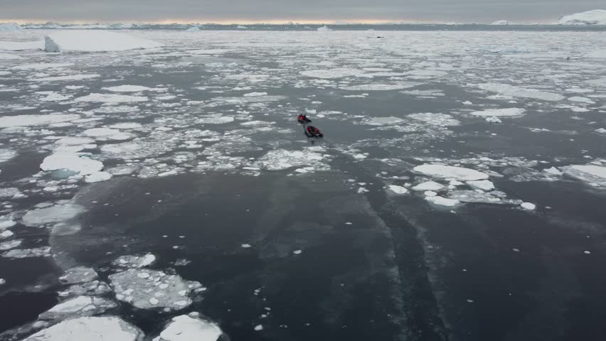 Two Small Boats Navigating Through Ice and Icebergs Near Perez Cape, Antarctica